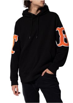 The black Burberry TB Logo Hoodie is crafted from soft cotton and boasts a comfortable, adjustable fit with a drawstring hood, ribbed cuffs and hem. The iconic Thomas Burberry lettering on the sleeves adds a touch of designer style. Stay cozy and fashionable this season with this must-have hoodie. 100% Black Cotton Kangaroo Pocket Ribbed cuffs and hem TB orange sleeve patches Drawstring Hood Designer Style: 8042699 Imported Thomas Burberry, Buy Hoodies, Logo Black, Designer Style, Cotton Hoodie, Stay Cozy, Mens Shirt Dress, Cloth Bags, Emporio Armani