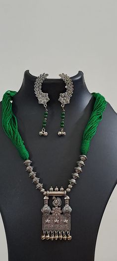 This is an elegant and unique thread necklace with traditional silver pendant. Its simplicity and elegance will add to the style statement. Festive Silver Pendant Beaded Necklaces, Festive Silver Beaded Necklaces With Pendant, Festive Silver Beaded Pendant Necklaces, Silver Bohemian Necklaces With Cutdana, Bohemian Silver Necklaces With Cutdana, Traditional Pendant, Green Thread, Thread Necklace, Wedding Necklaces