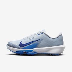 the nike air zoom golf shoe is shown in blue, white and grey with reflective accents