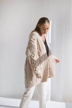 "Whatever stage in your life you may be - time always seems to pass by so quickly. We designed this oversize alpaca cardigan for the moments you wish time would stop. After all, what's most important is the laughter of a loved one, the feeling of the sea breeze on your cheek, and the warmth of a chunky wool cardigan. Embrace yourself with the softest knit, which is handmade from all-natural materials. DETAILS 65% Wool, 35% Alpaca wool. Light Beige color. You can choose any other color listed in Oversized Classic Beige Cardigan, Oversized Beige Wool Cardigan, Oversized Beige Winter Cardigan, Oversized Soft Knit Beige Cardigan, Beige Cardigan Outfit, Beige Long Sleeve Chunky Knit Cardigan, Chunky Cable Knit Cardigan, Alpaca Cardigan, Irish Women