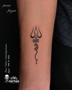 a tattoo on the arm of a person with a name and an arrow in it