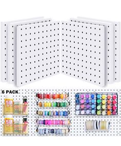 an assortment of crafting supplies on a pegboard with polka dot wall dividers