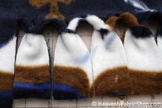 several pieces of blue and white knitted clothing