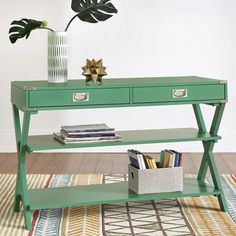 a green table with two drawers and a plant on top