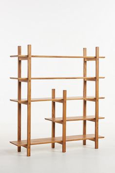 a wooden book shelf with three shelves on one side and two bookshelves on the other