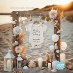 a baby's first birthday photo frame with seashells and candles on the beach