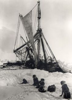 an old black and white photo of some people in the snow