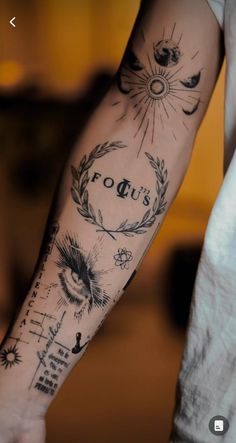 a person with a tattoo on their arm and the words focus are written in cursive writing