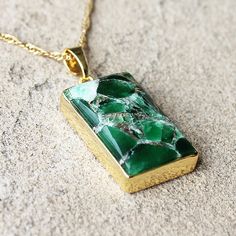 "This gorgeous dark green copper Turquoise rectangular birthstone pendant charm is surrounded by 18K Gold. Purchase the charm separately or with your choice of chain. Optional matching earrings at additional cost Stone: Turquoise Colour: Dark Green Birthstone: December Main Stone Size: 2.6cm high x 1.7cm wide Metal: 18K Gold Plated CHAIN Chain: 18K Gold Plated - Choose from 3 designs - Paperclip, Box or Figaro - all 18\" Length     - 18K Gold Filled 3mm PaperClip Chain     - 18K Gold Filled 1mm Link Figaro Chain      - 18K Gold Filled 1mm Box Chain  All gemstones are natural gemstones with inclusions. Each piece arrived beautifully packaged in a sturdy box, ready for gift giving or safe keeping. Gift wrapping can be selected as an add-on. I love making beautiful, handmade one-of-a-kind pie Gold Jewelry With Rectangular Polished Stone, Gold Jewelry With Polished Finish And Rectangular Stone, Rectangular Jade Gemstone Necklaces, Rectangular Jade Gemstone Necklace, Gold Plated Rectangular Gemstone Jewelry, Gold Plated Gemstone Jewelry In Rectangular Shape, Yellow Gold Rectangular Pendant For May Birthstone, Rectangular Gemstone Spiritual Jewelry, Rectangular Green Jewelry With Natural Stones