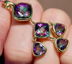 Metal: 14K 585 yellow gold Marks/Stamps: "AMI 14K"    Size: 1.8"/46 mm long  (including bail) X 0.86"/22mm wide  Weight: 6.67 grams  Mystic Topaz: checkerboard surface facets, beautiful rainbow glow  Condition: great vintage, Near Mint Luxury Gold Topaz Gemstones, Wedding Gift Baskets, Mystic Topaz, Beautiful Rainbow, Drop Pendant, Solid Yellow, Beautiful Jewelry, Topaz, Jewelry Necklace Pendant