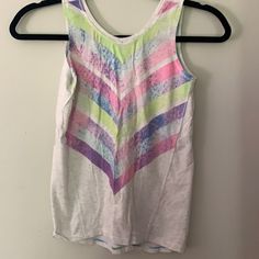 Cute Tank With Split Back. Pastel Design On Front. Brand New. Playful White Stretch Top, Sporty Sleeveless Multicolor Tops, Multicolor Sleeveless Gym Tops, Summer Athleisure T-shirt For Playwear, Sporty Summer Tops For Playwear, Spring Sports Tank Top In Multicolor, Spring Multicolor Sports Tank Top, Sporty Graphic Print Tops For Playwear, Playful Stretch Tops For Playtime