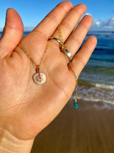 Kauai Puka Shell Necklace - Etsy White Abalone Shell Necklace For Beach, White Abalone Shell Beach-style Necklace, Dainty Shell Charm Necklace For Beach, Spiritual Shell Necklace Gift, Dainty White Shell Necklace, Dainty Shell Jewelry For Beach, Dainty Round Jewelry For Beach, Shell Necklace With Starfish Charm, Beach Jewelry With Round Shell