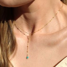 "Our lariat necklace is perfect minimalist jewelry. This dainty necklace is perfect with your favorite tee or your little black dress. A natural turquoise drop adorns a 14kt gold filled satellite chain.  D E T A I L S *Natural Arizona turquoise chips *2 inch drop  *Dainty satellite chain *100% 14kt gold dainty link chain  LENGTH *The standard length is normally 18\". *Model is wearing a 16\" in Photos. HOW TO PERSONALIZE *Select your choices from the drop down menu to create your custom design. ∙ EXTRA LOVE ∙ Handcrafted just for you in sunny Arizona by a team of talented women. All of our jewelry comes gift packaged! We are happy to leave a note if this is a special gift, just let us know in the message box at checkout. PRODUCTION ∙ TIMES All items are made to order. Please check the esti Dainty Lariat Necklace, Minimalist Blue Jewelry With Adjustable Length, Minimalist Gold Turquoise Necklace, Dainty Adjustable Lariat Necklace With Clavicle Chain, Turquoise Jewelry With Adjustable Length For Gifts, Turquoise Lariat Necklace With Adjustable Chain, Dainty Adjustable Lariat Drop Necklace, Dainty Adjustable Lariat Necklace With Delicate Chain, Gold Adjustable Minimalist Turquoise Necklace