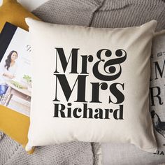 a pillow with the words mr and mrs richard printed on it next to some books