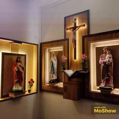 three framed images of jesus and mary on display