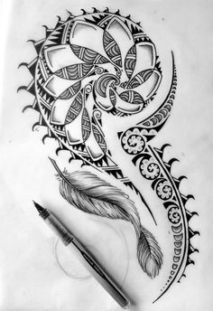 a drawing of a feather and an ornamental design on paper with a pen in the foreground