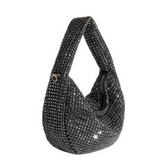 The Milly crossbody bag is your perfect companion for a night out. Embellished with shiny crystals, this sparkly statement piece that will surely make you the center of attention. Carry it from the handle or attach the crossbody strap for a hands-free option. Crystal Glass 9.5"W x 5"H x 2.5"D Handle Drop: 3.5" Strap Length: 34" Zipper Closure Silver-Tone Hardware Interior Zip Pocket Polyester Lining Fits up to an iPhone 14 Pro Product No. DE9912K Handheld Evening Bag With Rhinestones For Night Out, Crossbody Evening Bag With Detachable Handle For Night Out, Detachable Handle Crossbody Evening Bag For Night Out, Glamorous Evening Bag With Detachable Handle For Night Out, Luxury Crossbody Evening Bag For Night Out, Glamorous Top Handle Shoulder Bag For Night Out, Handheld Rhinestones Shoulder Bag For Night Out, Silver Top Handle Evening Bag For Night Out, Evening Shoulder Bag With Rhinestones Crossbody