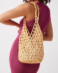 Chunky beads in an open lattice design give the FIJI bag a beachy vibe with a drawstring lining to keep all your valuables secure. Beaded shoulder bag Lined interior with drawstring closure Interior zipper pocket Open lattice beading 11.5in H x 7in W x 7in D Synthetic materials Duster bag included Imported Summer Beaded Rectangular Beach Bag, Summer Vacation Beaded Shoulder Bag, Summer Vacation Beaded Beach Bag, Beaded Crochet Rectangular Bag For Beach, Bohemian Beaded Beach Bag For Summer, Summer Beaded Shoulder Bag For Daily Use, Beaded Shoulder Bag For Daily Use In Summer, Summer Beaded Crochet Bag, Bohemian Beaded Crochet Beach Bag