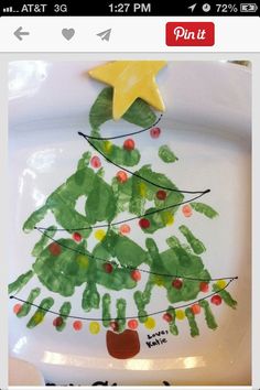 a white plate with a christmas tree painted on it