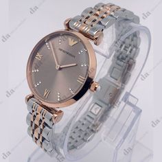 Sale! Last One!Emporio Armani Two Tone Rose Gold Stainless Steel Women's Watch - Band New With Tags! - Limited Quanity -100% Authentic - Full Retail Package With All Accesories About The Watch: Case Size: 31 Mm Case Thickness: 7.5 Mm Band Material: Stainless Steel Band Color: Two-Tone Band Width: 14 Mm Water Resistance: 30 Meters / 100 Fee Rose Gold Jewelry And Watches For Formal Occasions, Elegant Rose Gold Watch With Metal Dial, Elegant Silver Watch With Metal Dial, Luxury Silver Watches With Metal Dial, Luxury Silver Watch With Metal Dial, Elegant Rose Gold Diamond Analog Watch, Swiss Watches For Men, Dior Watch, London Watch