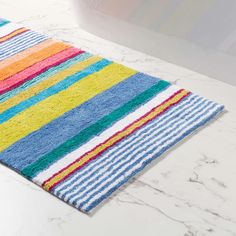 a multicolored bathroom rug on a white countertop