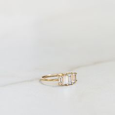 14k Gold Vermeil over .925 sterling silver. White CZ stone. Each piece is made by hand. We recommend using a soft cloth to clean your ring. Please do not use a silver polishing cloth as this will remove the gold plating. Keep your ring away from any beauty products or water to preserve it's look. Ring My Bell, Baguette Ring, Cz Stone, Gold Plating, Gold Vermeil, Stone Color, Beauty Products, Gold Plate, Wedding Rings