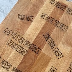 wooden cutting board with words written on it