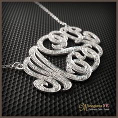 "Our Cutoff Date for Christmas delivery is Sunday Dec. 13, 2020 All Order placed after this date will be completed for mid January delivery. Personalized gold and diamond monogram necklace 1.0\" inch high, 1.5\" wide and about 1mm thick, made of solid 14kt. white gold and has a total of 0.80ct. in diamonds. The necklace suspends from a cable Link chain with 3 choices of length: 14\",16\" and 18\". The Monogram can be made with the initials of your choice. Please use the note section available at Anniversary Monogram Jewelry In Cubic Zirconia, Monogram Diamond Jewelry For Weddings, Luxury Silver Monogram Necklace, Luxury White Gold Necklace With Hallmarks, Luxury Silver Necklace With Hallmarks, Luxury Monogram Silver Necklace, Diamond Monogram Jewelry For Anniversary, Luxury Silver Name Necklace With Diamond Accents, Luxury Silver Initial Pendant Name Necklace