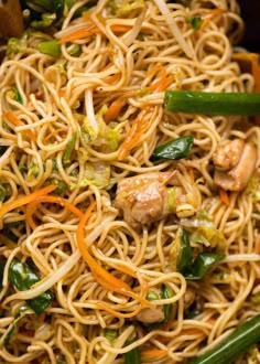 the noodles are mixed with vegetables and meat