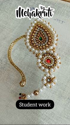 a necklace with pearls and beads on it