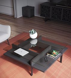 a coffee table with magazines on it in the middle of a wooden floored living room