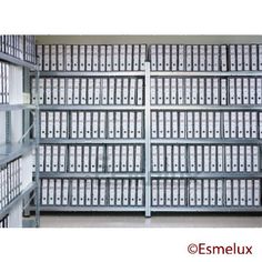 the shelves are full of files and folders in this storage room at esmelux