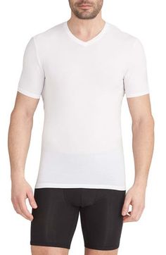 Silky, stretchy and ridiculously comfortable, these undershirts resist pilling and bunching around the collar and sport a longer length to stay tucked in. 28" length (size Medium) Pack of two undershirts V-neck Short sleeves 90% Tencel® modal, 10% Lycra® spandex Tencel modal is a sustainably produced fiber made with closed-loop processing and is certified with the EU Ecolabel as having a low environmental impact throughout the entire lifecycle Machine wash, tumble dry Imported White V-neck Top With Seamless Collar, Stretch V-neck T-shirt For Layering, V-neck Stretch T-shirt For Layering, White Moisture-wicking V-neck Tops, Sporty Fitted V-neck T-shirt, Fitted V-neck Moisture-wicking T-shirt, Fitted V-neck T-shirt For Sports, Tommy John, Kids Branding