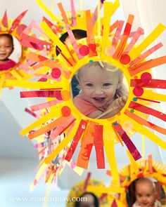 a child's photo is in the center of a sunburst decoration