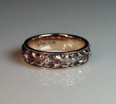 a wedding ring with three diamonds on it