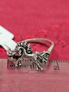 This sterling silver UNICORN H-6U ring is hand crafted and made in Minnesota.  It has good detailing of the design.  This ring is sold in sizes from 8 to 8 1/2 USA scale.  Please shop my other items on ETSY in the AllasIFoundIt LLC store.  Many different animals, flowers, and unique designs on the sterling silver band. Fairytale Ring, Unicorn Ring, Turtle Ring, Unicorn Jewelry, Animals Flowers, Silver Eagles, Animal Rings, Statement Ring Silver, Fantasy Jewelry