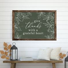 a wooden sign that says give thanks with a grateful heart on the side of a bench