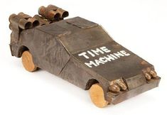 a wooden toy car that has time machine written on it