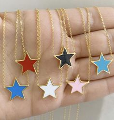 Beautiful star necklaces in different enamel colorsPerfect for all ages-sterling silver -gold plated-14 inch chain with 2 inch extension** in the "letter to seller" section please include your email address and the color star you want!free shipping!!!If your order is a gift, I can wrap them in an elegant gift box (free of charge) If you have questions please don't hesitate to ask. Happy shopping!!! Gold Enamel Star Jewelry, Enamel Star Charm Jewelry, Star Necklaces, Diamond Cufflink, Preppy Jewelry, Star Necklace Gold, Enamel Necklaces, Charm Rings, Colour Star