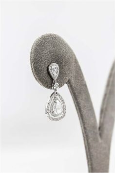 For Sale on 1stdibs - Showcasing rose cut pear shape diamonds, set in a double halo of open-work design. Suspended on another rose cut pear shape diamond in a diamond halo. Luxury Pear-shaped Teardrop Earrings For Formal Occasions, Diamond White Pear-shaped Teardrop Earrings For Formal Occasions, Luxury Teardrop Diamond Earrings With Halo Design, Luxury Diamond Teardrop Earrings, Silver Bridal Earrings Brilliant Cut Pear-shaped, Silver Pear-shaped Brilliant Cut Bridal Earrings, Silver Pear-shaped Bridal Earrings With Brilliant Cut, Luxury Cubic Zirconia Teardrop Earrings, Luxury Pear-shaped Halo Diamond Earrings