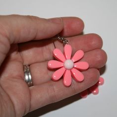 "90s Inspired Daisy Earrings Super cute and made of plastic Measures 2\" long including hooks" Retro Pink Jewelry For Spring, Pink Retro Jewelry For Spring, Spring Retro Flower Earrings Gift, Pink Retro Earrings For Spring, Retro Flower Earrings For Spring, Retro Spring Flower Earrings, Retro Yellow Flower Jewelry, Retro Adjustable Pink Earrings, Daisy-shaped Earrings For Summer