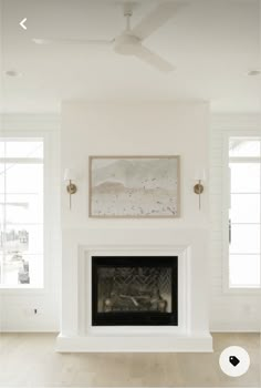 an empty living room with white walls and wood floors