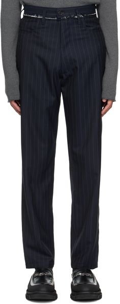 Relaxed-fit wool twill trousers. Pinstripes throughout. · Distressing and belt loops at waistband · Three-pocket styling · Zip-fly · Pleats at front · Partial plain-woven cotton lining Supplier color: Navy pinstripe Business Striped Pants With Belt Loops, Tailored Striped Bottoms With Belt Loops, Pinstripe Trousers, Twill Trousers, Woven Cotton, Luxury Streetwear, Cotton Weaving, Bottoms Pants, Designer Fashion