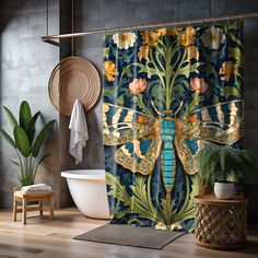 a blue and yellow shower curtain with a dragonfly design on it next to a bathtub