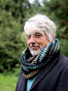 Chunky infinity scarf men in dark colors, handmade wool loop scarf, Christmas gift for dad or husband, ski or snowboard accessories A unique infinity scarf  in beautiful shades of blue and gold with black.  Made by hand, crochet, woolen yarn with the addition of acrylic, providing warmth and softness. Interestingly, it works fantastic on skis or snowboarding, perfectly protecting against the cold and making its user stand out from the crowd. The order of colors on the scarf may differ from what Snowboard Accessories, Crochet Mens Scarf, Chunky Infinity Scarves, Snowboarding Accessories, Etsy Christmas, Loop Scarf, Christmas Gift For Dad, Scarf Men, Mens Scarves