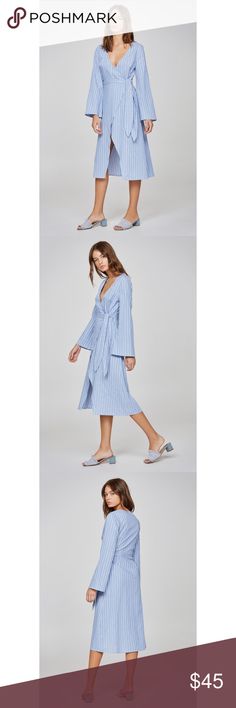 The Fifth Label Long Sleeve Striped Wrap Dress Relaxed fit midi wrap dress from The Fifth Label -Wrap front with ties and internal button closure -Flared sleeve -Lightweight woven stripe fabric -Model is 5’7” & wearing Size S -79% cotton, 21% polyester  -Brand new in package The Fifth Label Dresses Midi Midi Wrap Dress, Stripe Fabric, Striped Fabrics, Boutique Dresses, Dresses Midi, Wrap Dress, Shirt Dress, Midi Dress, Relaxed Fit