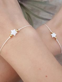 🌙 Handcrafted bridesmaid white cord bracelet with pearl star charm 🌙 Easily adjustable with macrame closure 🌙 All materials used are tarnish free and durable 🌙 Best gift for your friends and family or just for yourself 🌙 Regular shipping takes approximately 10-15 business days depending on your country. Express shipping takes 3-5 business days. Please choose express shipping if you want to receive your package faster 🌙 I do offer combined shipping. Please feel free to contact me for custom Delicate Adjustable White Friendship Bracelets, Delicate White Adjustable Friendship Bracelets, White Delicate Adjustable Friendship Bracelets, White Jewelry With Adjustable Cord For Everyday, Dainty White Resizable Jewelry, Delicate White Friendship Bracelets As Gift, Delicate White Friendship Bracelets Gift, Minimalist White Jewelry With Adjustable Length, Delicate White Friendship Bracelet As Gift