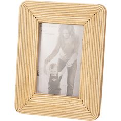 an old photo frame with a man holding a small child's hand in it