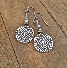 "Geometric, boho small silver dangle earrings with tribal etched pattern. Small, light weight boho, tribal inspired silver dangle earrings. Perfect for everyday wear and will add a little boho, southwestern vibe to your favorite outfit. Product overview: - Made with silver plated pewter drops and antiqued silver accents - Total hanging length of 1.75\" - Light weight and versatile, perfect for everyday wear - Hypoallergenic ear wiresPlease sign up for the Rustica Jewelry newsletter to receive sp Artisan Etched Drop Earrings, Antique Silver Bohemian Earrings, Bohemian Etched Teardrop Jewelry, Adjustable Silver Bohemian Earrings, Bohemian Sterling Silver Earrings With Oxidized Finish, Bohemian Drop Earrings With Etched Details, Metal Dangle Jewelry With Etched Details, Bohemian Etched Drop Earrings, Bohemian Stamped Earrings