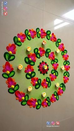 a circular design made out of flowers on a wall